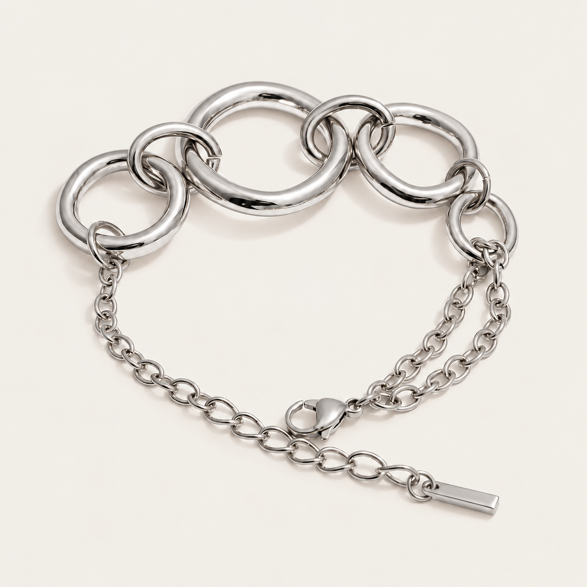 Silver chunky circular-link bracelet with an adjustable chain extender, product shot for the Folie à Trois Cluster BRACELET.