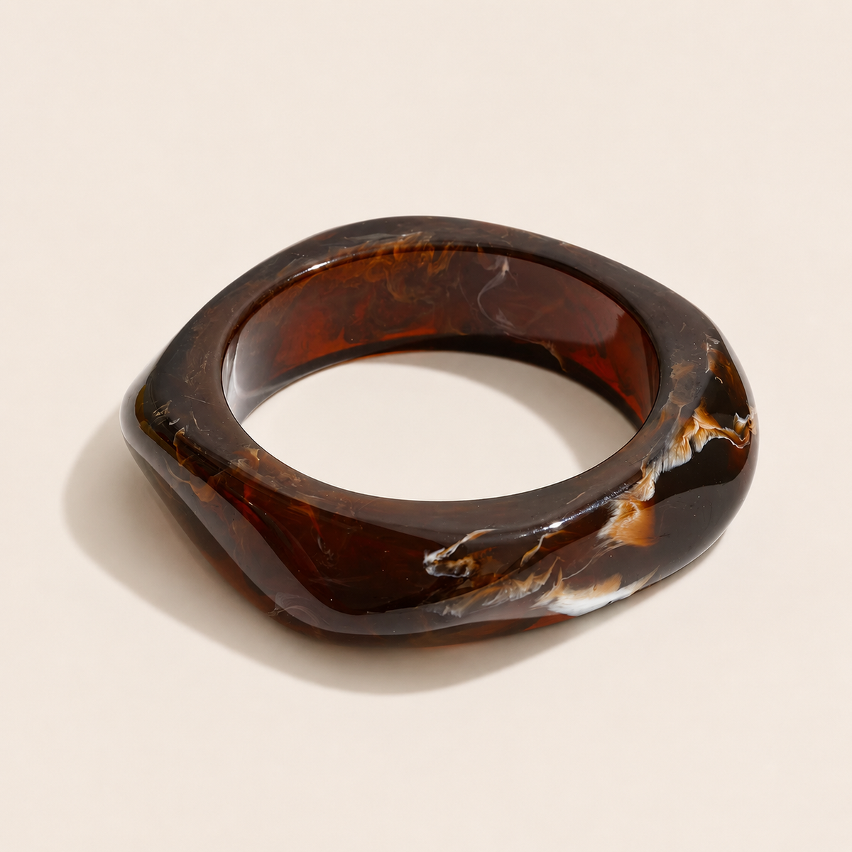 Coastal Escape BRACELET in dark chocolate brown marbled resin, a chunky angular bangle shown on a cream background.