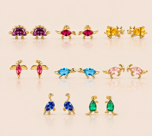 Grid of gold dinosaur stud earrings from the Colorful Dino EARRINGS in purple, pink, yellow, blue, and green cubic zirconia colorways.