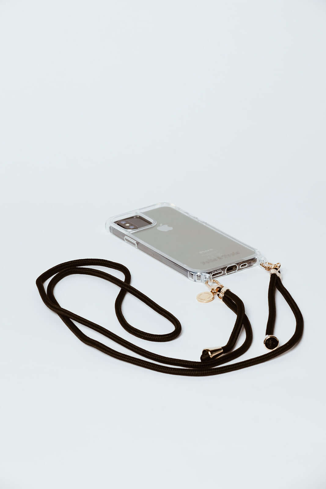 Black Colorful PHONE CORD with gold-tone hardware attached to a clear phone case on a white background.