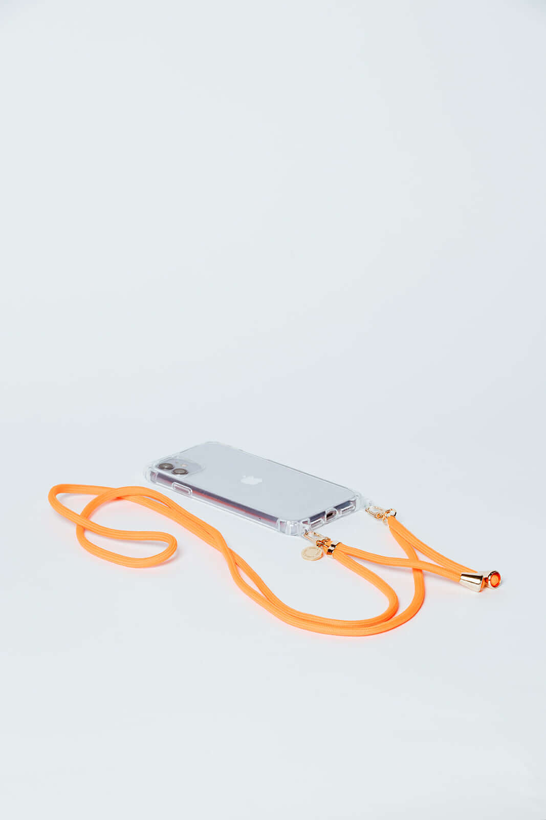 Orange Colorful PHONE CORD attached to a clear phone case, laid flat on a white background.