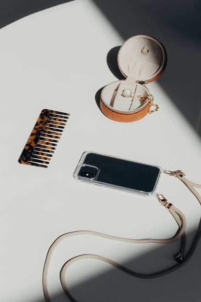 Beige Colorful PHONE CORD, phone displayed next to a tortoiseshell hair clip and a jewelry box.