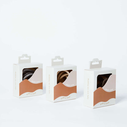 Three Colorful PHONE CORD packaging boxes showing black and white, beige and patterned cords.