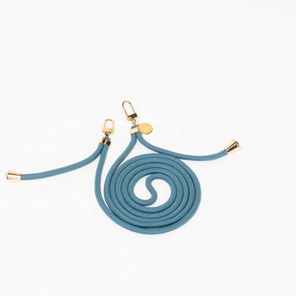 Slate blue Colorful PHONE CORD coiled with gold-tone hardware on a white background.