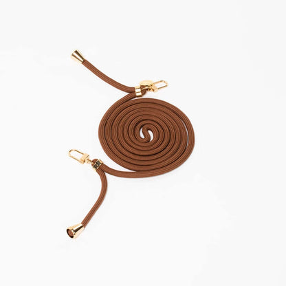 Brown Colorful PHONE CORD coiled neatly with gold-tone hardware on a white background.
