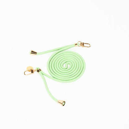 Mint green Colorful PHONE CORD coiled with gold-tone hardware on a white background.