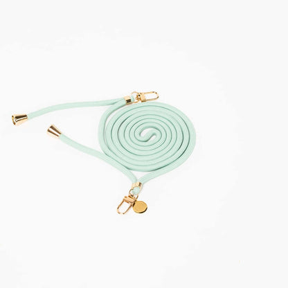 Seafoam green Colorful PHONE CORD coiled with gold-tone hardware on a white background.