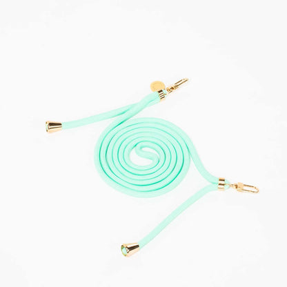 Mint green Colorful PHONE CORD coiled with gold-tone hardware, shown from another angle on white.