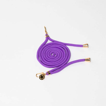 Purple Colorful PHONE CORD coiled with gold-tone hardware on a white background.