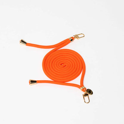 Orange Colorful PHONE CORD coiled with gold-tone hardware on a white background.