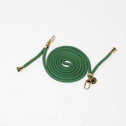 Green Colorful PHONE CORD coiled neatly with gold-tone hardware on a white background.