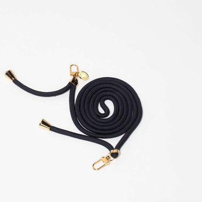 Navy blue Colorful PHONE CORD coiled with gold-tone hardware on a white background.