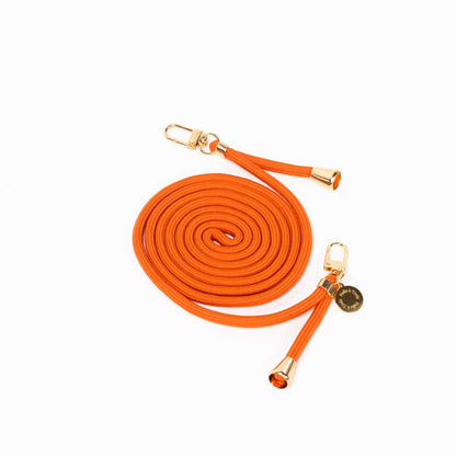 Orange Colorful PHONE CORD coiled with gold-tone hardware, shown from another angle on white.