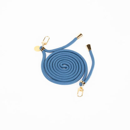 Steel blue Colorful PHONE CORD coiled with gold-tone hardware on a white background.