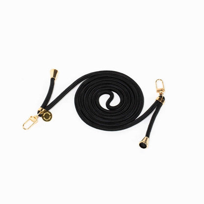Black Colorful PHONE CORD coiled neatly with gold-tone hardware on a white background.