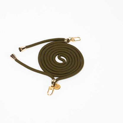 Olive green Colorful PHONE CORD coiled with gold-tone hardware on a white background.