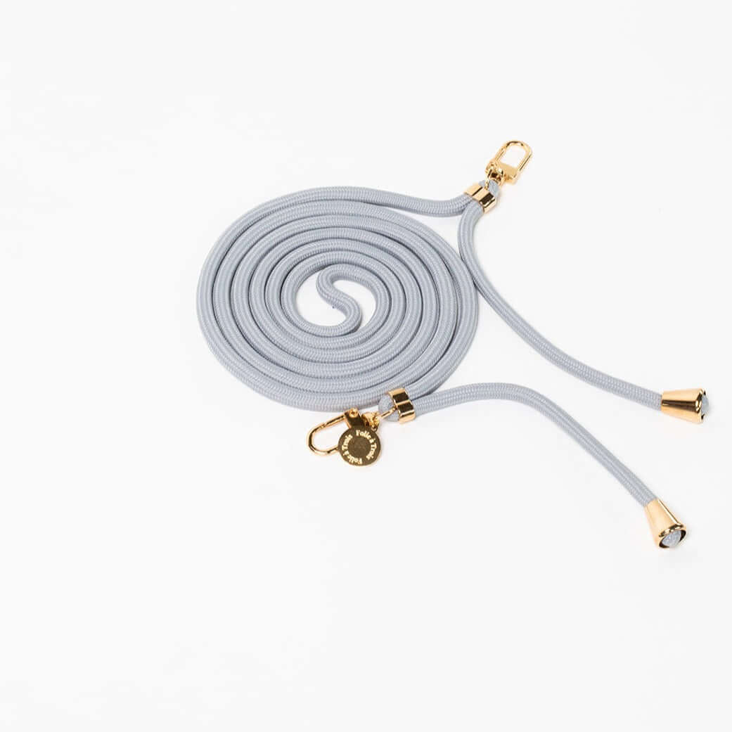 Light gray Colorful PHONE CORD coiled with gold-tone hardware, shown from another angle on white.