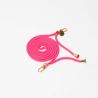 Hot pink Colorful PHONE CORD coiled with gold-tone hardware, shown from another angle on white.