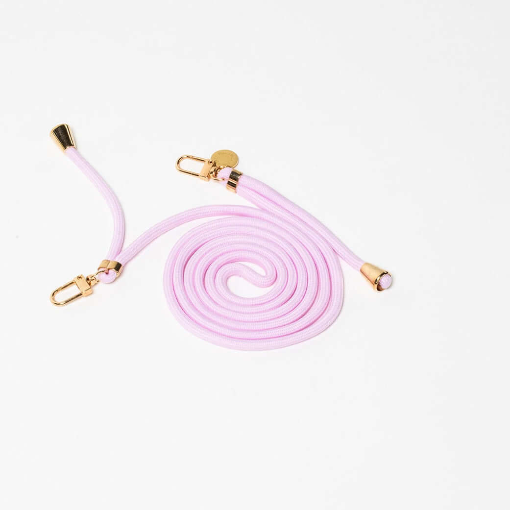 Pale lilac Colorful PHONE CORD coiled with gold-tone hardware on a white background.