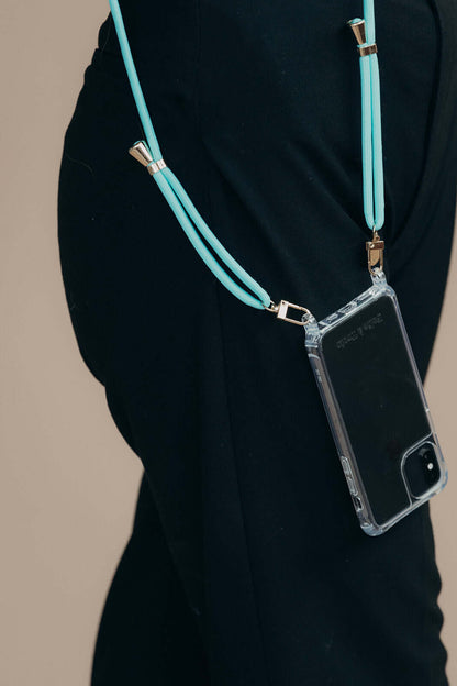 Teal Colorful PHONE CORD draped over a model's leg, clear phone case visible nearby.