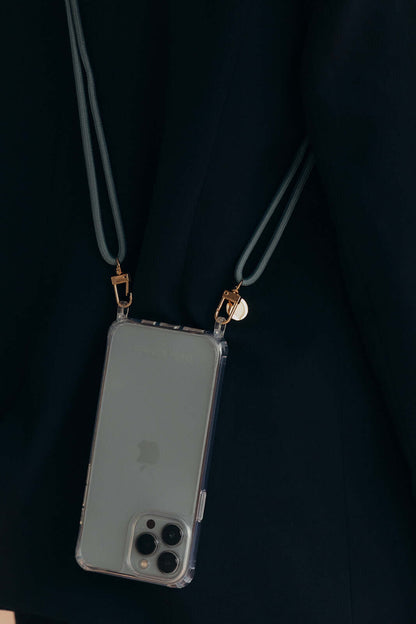 Dark teal Colorful PHONE CORD, phone hanging against a model's dark navy clothing.