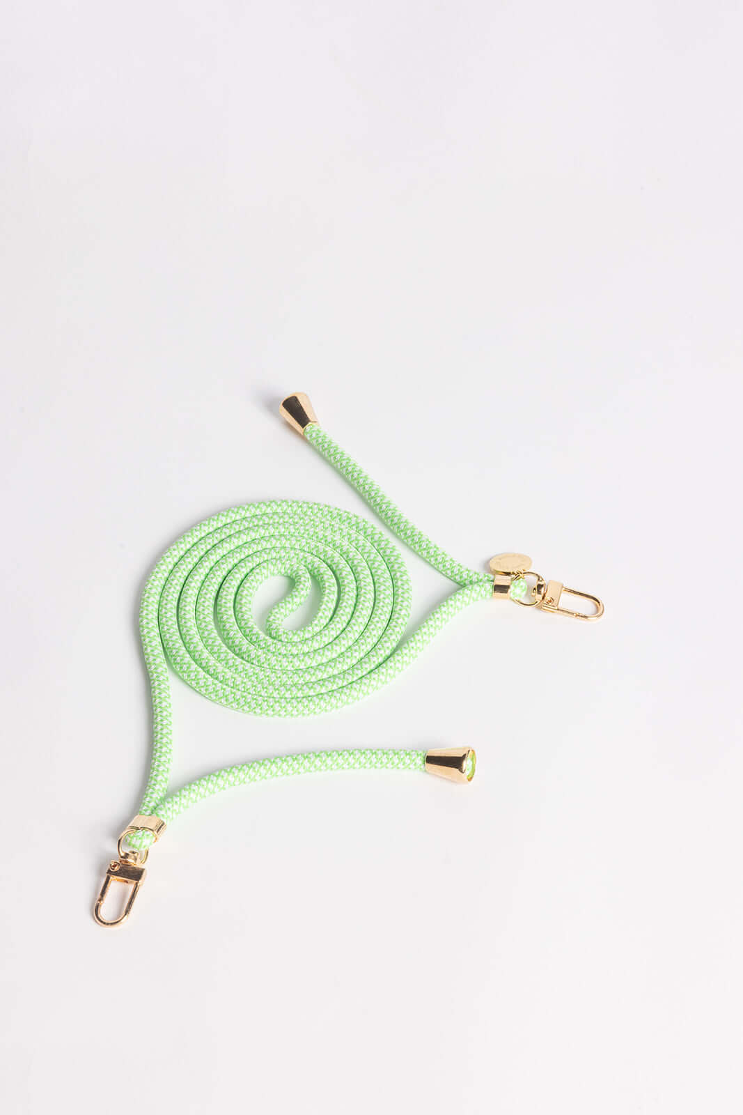 Mint green speckled Colorful PHONE CORD coiled with gold-tone hardware on a white background.