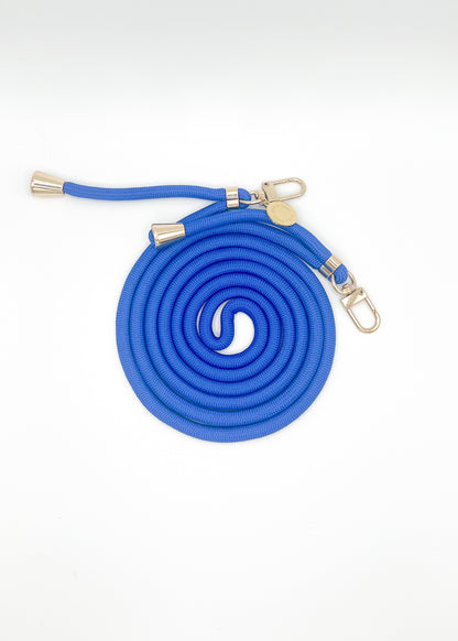 Blue Colorful PHONE CORD coiled with silver-tone hardware on a white background.