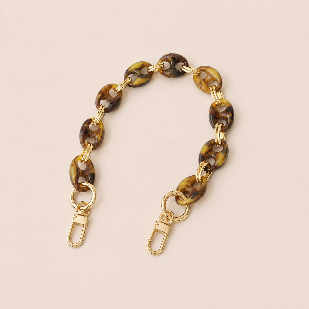 Round olive brown tortoiseshell coin-link phone chain with gold connectors on cream — Folie à Trois Corvin wholesale phone chain