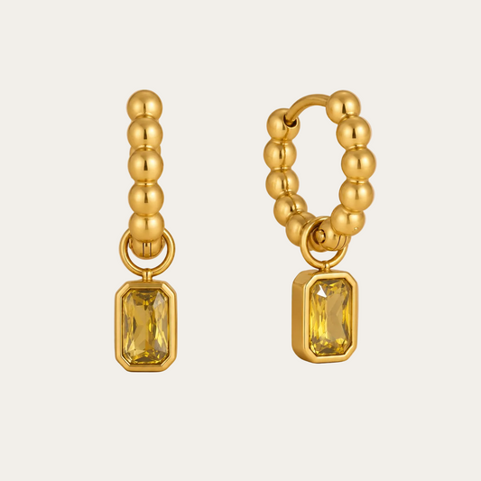 Gold beaded hoop earring with a dangling emerald-cut yellow zirconia charm — Folie à Trois Costa EARRINGS.