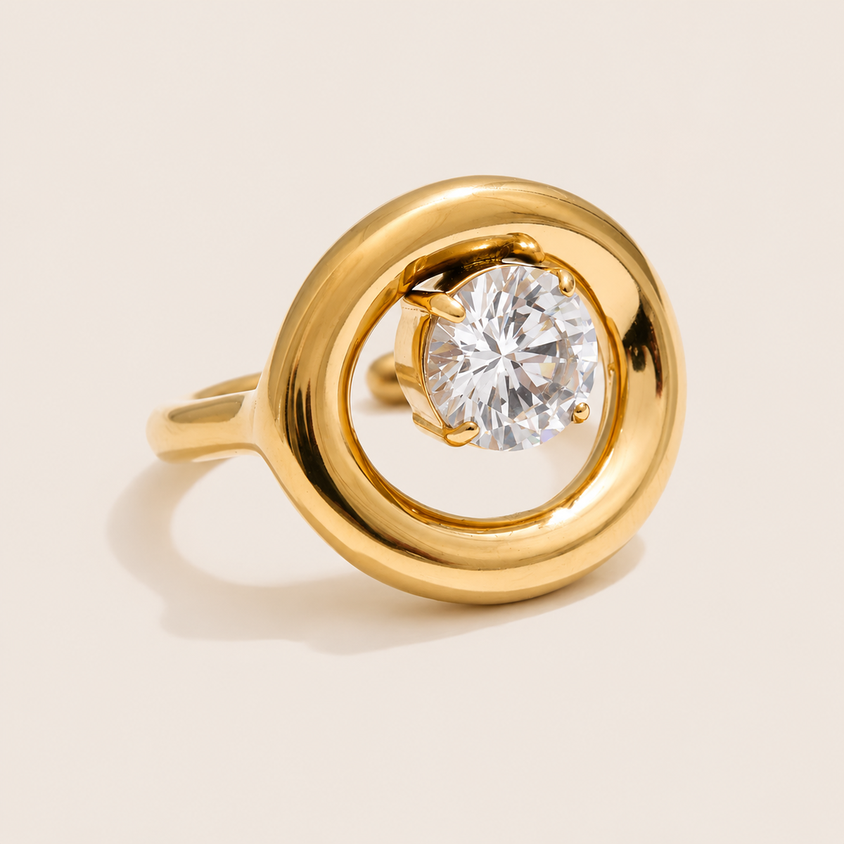 Gold ring with a thick circular loop framing a large round-cut white zirconia stone at its center — Folie à Trois Côte Club RING.