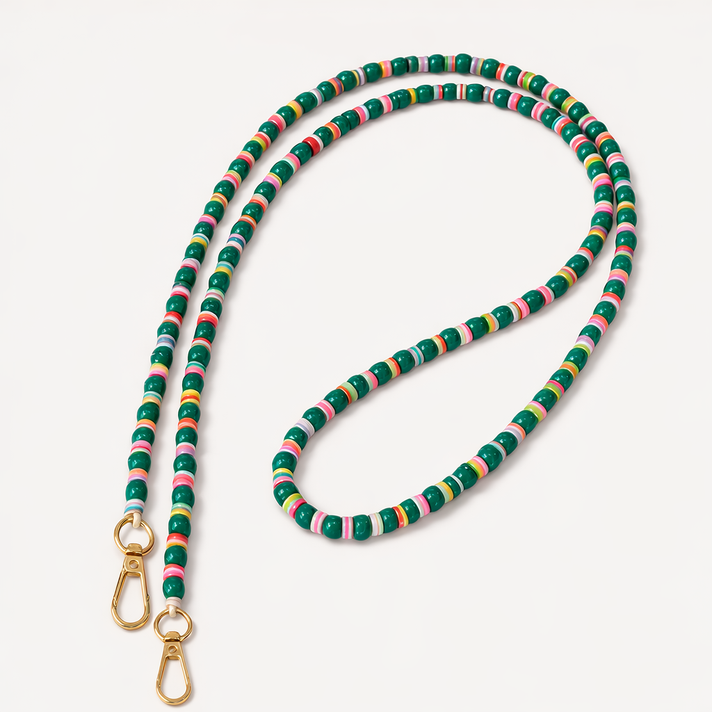 Green beaded Cove LONG PHONE CHAIN with colorful striped accent beads and a gold clasp, shown as a flat lay.