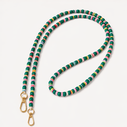 Green beaded Cove LONG PHONE CHAIN with colorful striped accent beads and a gold clasp, shown as a flat lay.