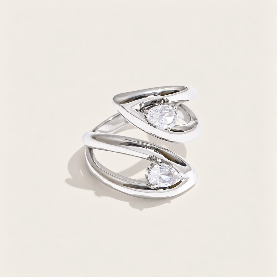Silver-tone Croisé RING: two overlapping bands crossing around an oval white zirconia stone — Folie à Trois