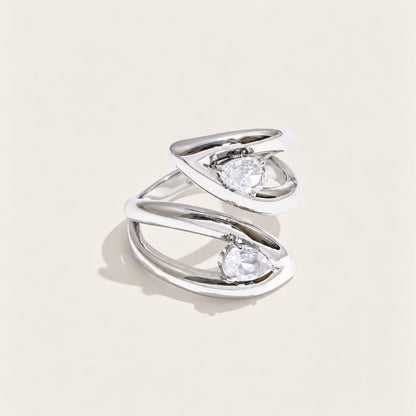 Silver-tone Croisé RING: two overlapping bands crossing around an oval white zirconia stone — Folie à Trois