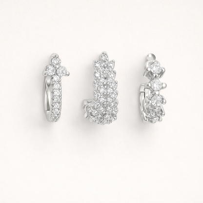 Daisy Set in silver tone, a pave hoop with a flower cluster top, a fully pave leaf-shaped hoop, and a graduated stone hoop.