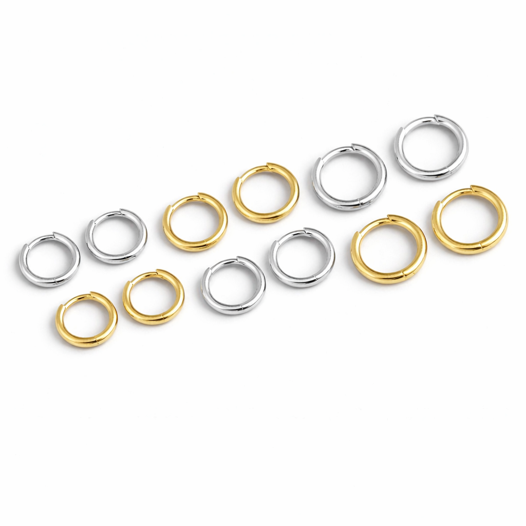 Daytime Exploring Earrings offer plain round huggie hoops in gold and silver, arranged in several sizes.