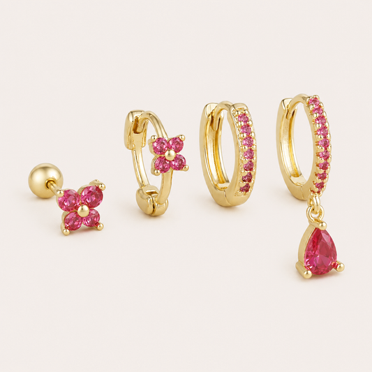 Four-piece Deanna SET gold earrings in pink: a flower stud, a flower hoop, a pave hoop, and a pave hoop with a pear-cut drop charm.
