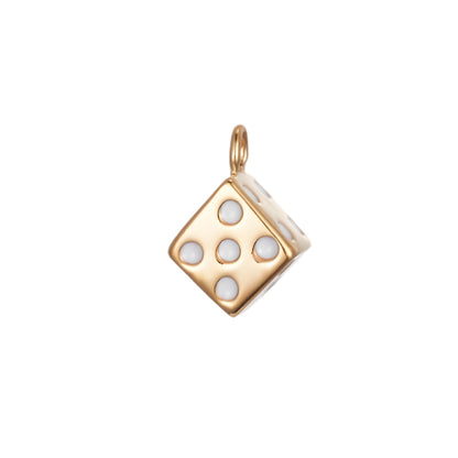 The Dice CHARM in gold, a cube-shaped pendant set with white enamel pips, shown in close-up studio photography on white.