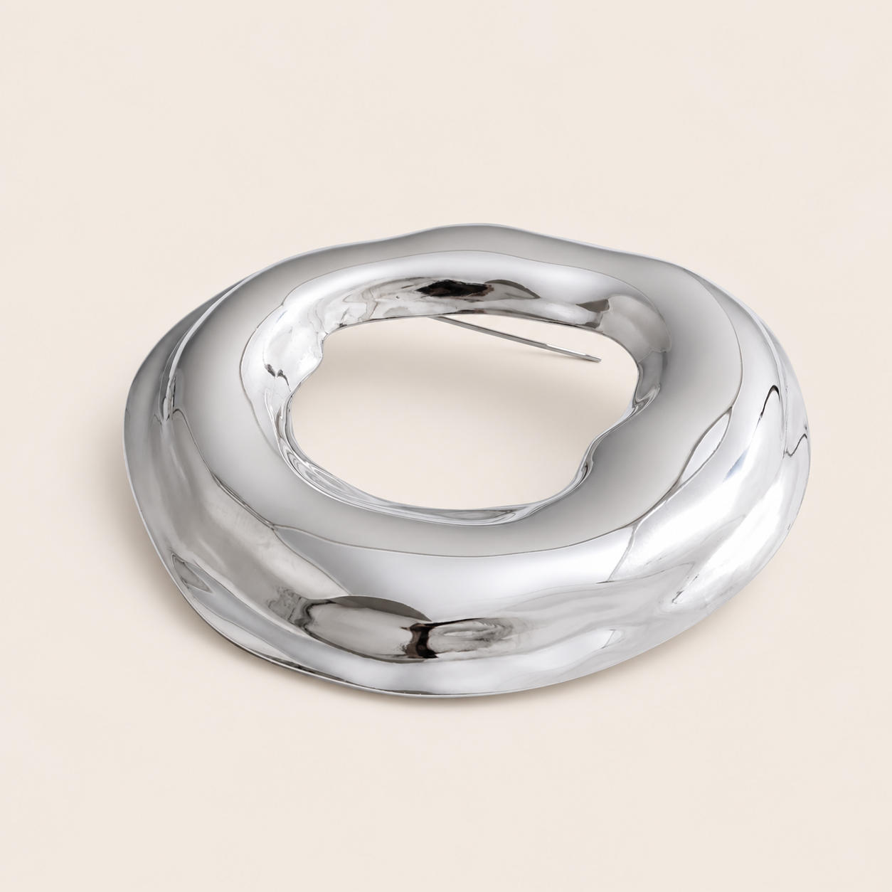 Silver molten organic-shaped ring brooch, large size, on a cream backdrop — Folie à Trois Duna BROOCH