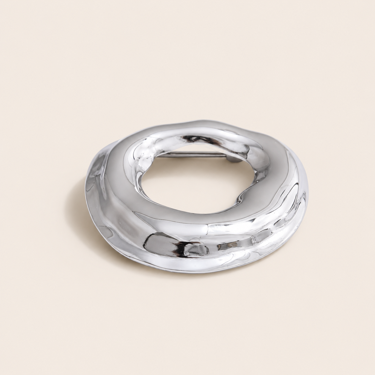 Silver molten organic-shaped ring brooch, small size, on a cream backdrop — Folie à Trois Duna BROOCH
