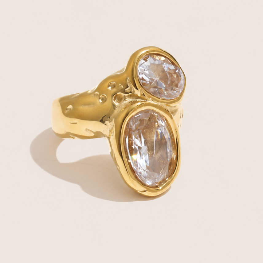 Gold ring with two bezel-set oval white zirconia stones on a hammered, organic-texture band — Folie à Trois Dune Twist RING