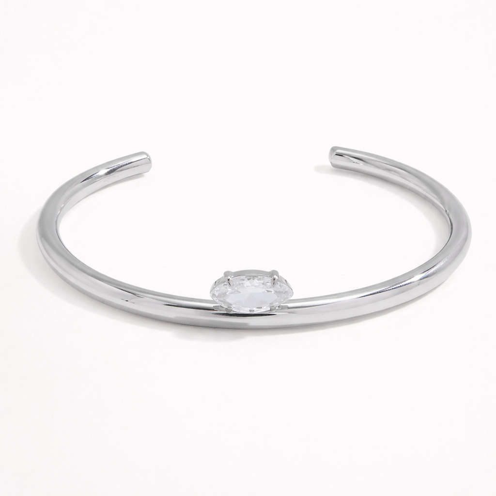 Electric Frost BRACELET in silver, a slim open cuff with a single marquise crystal, shown alone on white.