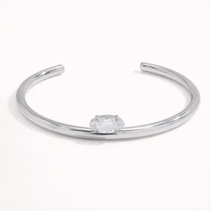 Electric Frost BRACELET in silver, a slim open cuff with a single marquise crystal, shown alone on white.