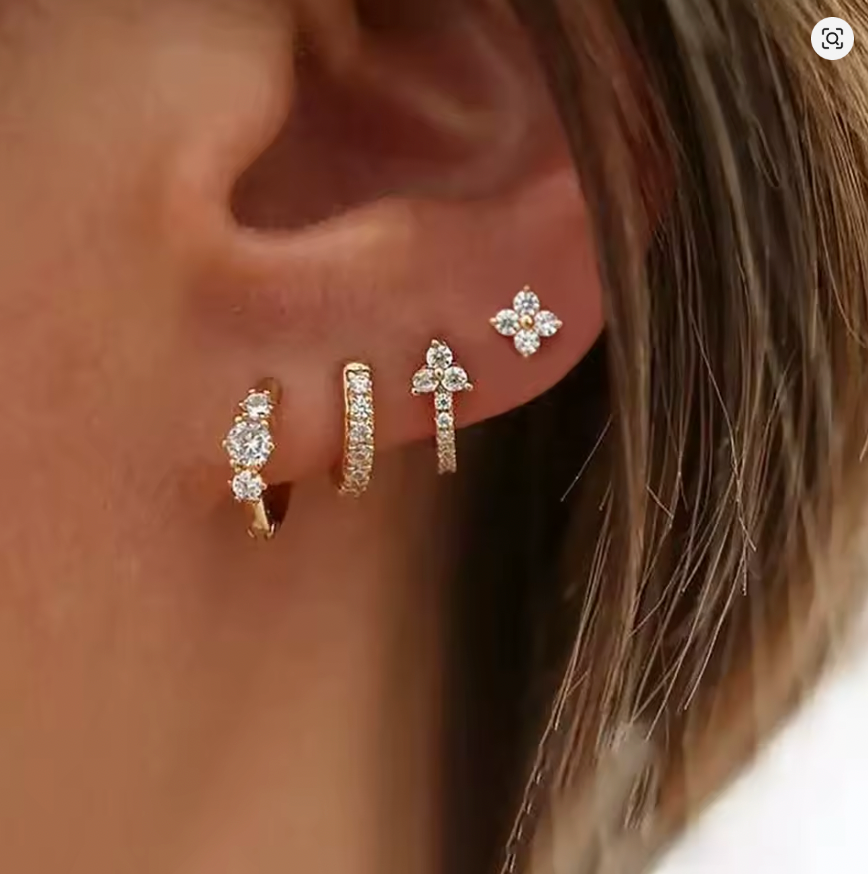 Worn along the ear, the Elle SET layers a clover stud with three graduated pave and crystal-cluster hoops.
