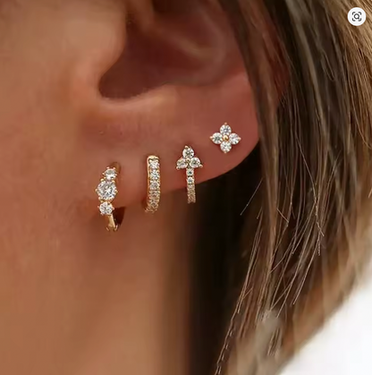 Worn along the ear, the Elle SET layers a clover stud with three graduated pave and crystal-cluster hoops.