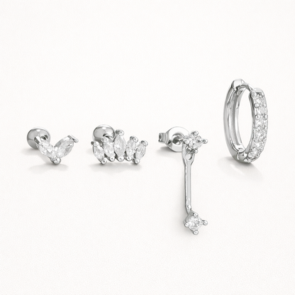 Elodie Set in silver tone, showing the same marquise cluster stud, crown stud, crystal drop, and pave huggie hoop pieces.