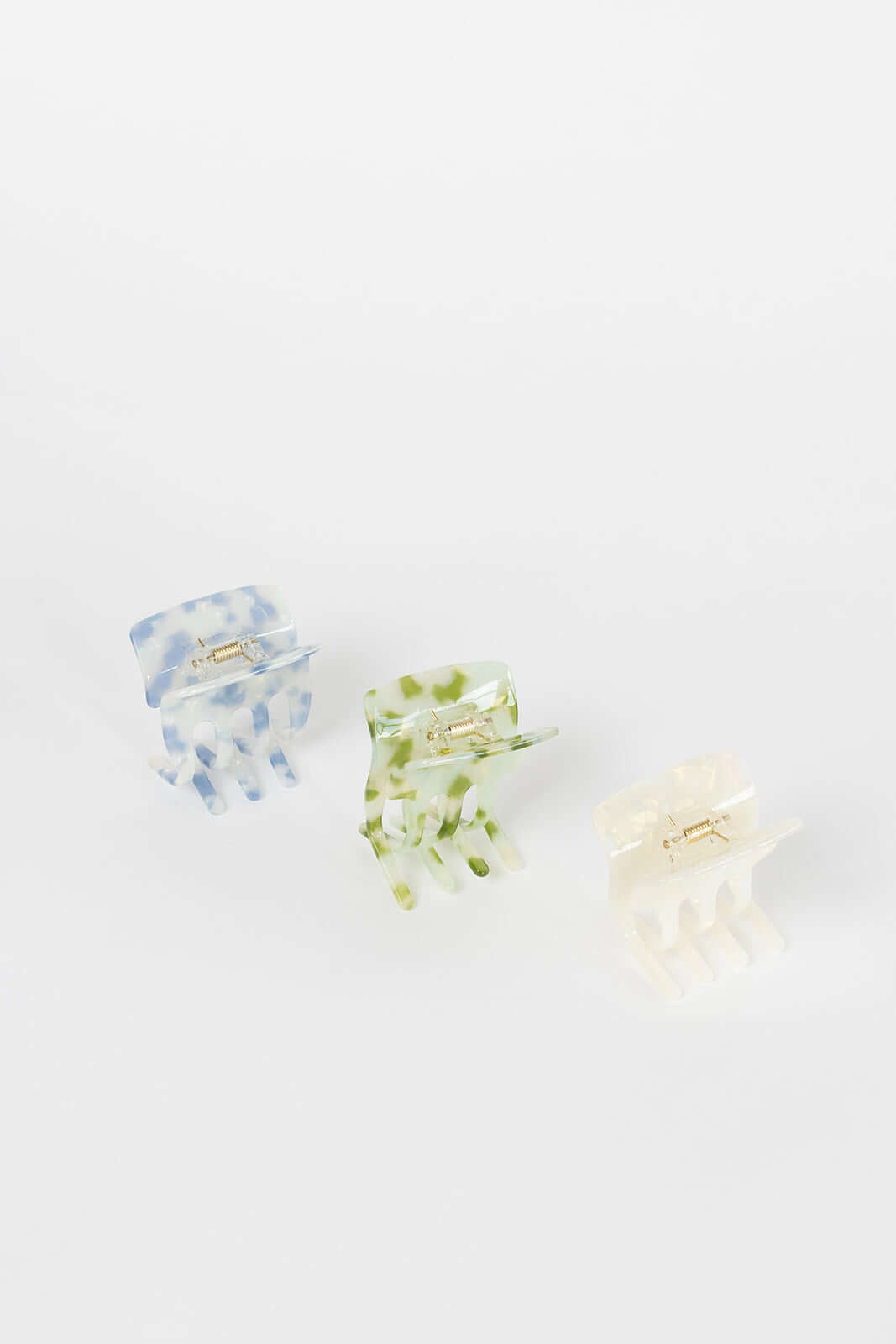 Enchanted Garden HAIR CLIP three claw clips shown together in blue, green and cream marbled colorways, studio shot.