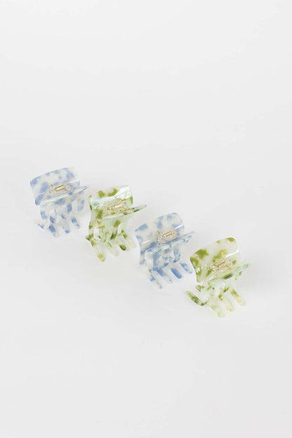 Enchanted Garden HAIR CLIP four claw clips arranged diagonally in blue and green marbled colorways, studio shot.
