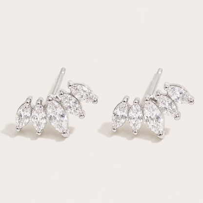 Silver-tone marquise-cut zirconia climber studs fanned in a cluster on a cream backdrop — Folie à Trois Facet EARRINGS wholesale jewelry