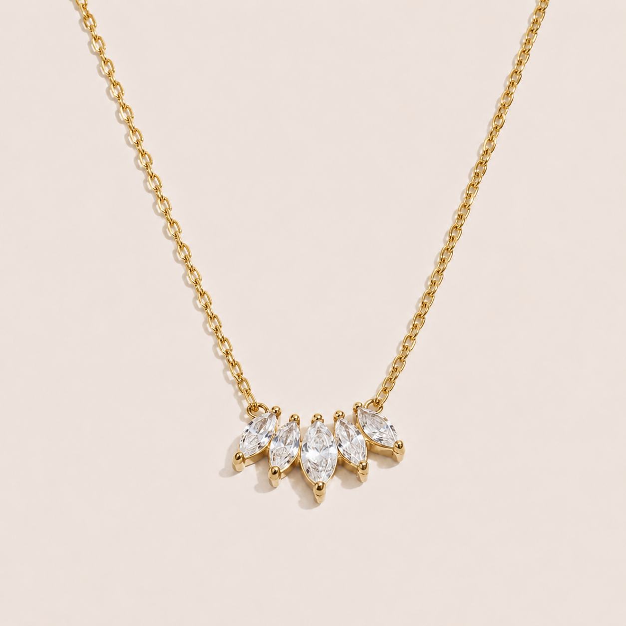 Gold pendant necklace with five marquise-cut white zirconia stones fanned along a fine chain — Folie à Trois Facet NECKLACE
